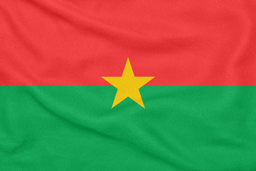 Flag of Burkina Faso on textured fabric. Patriotic symbol