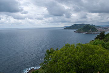 Top view of landscape of San Sebastian coastline from Mount Igueldo in Basque Country, Spain, Europe. A cloudy morning of spring.