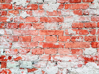 Rough red brick wall background texture.
