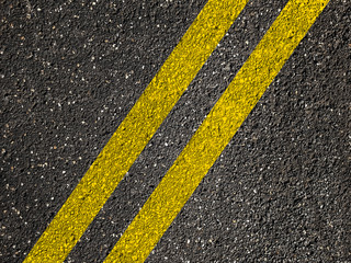 Fototapeta premium Asphalt road with double yellow lines.