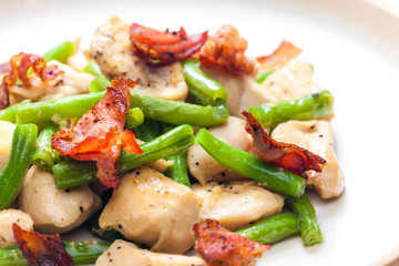 still life of chicken meat with green beans and bacon