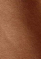  Texture of genuine leather. Brown background. The structure of the leather material close-up.