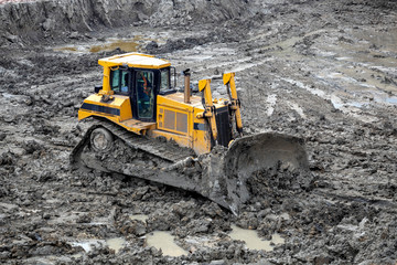 Push dirt with a dozer