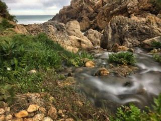 Small river empties into the sea