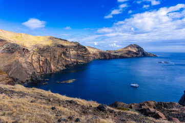 View of the bay and yacht at between cliffs at Ponta de Sao Lourenco, Madeira