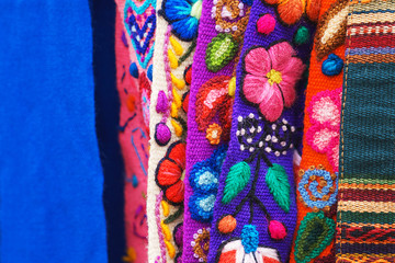 Peruvian traditional colorful native handicraft textile fabric at market in Machu Picchu, one of the New Seven Wonder of The World, Cusco Region Peru, South America. Selective focus, Close up.