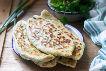Baker making traditional dish of Armenians from Artsakh Zhingyalov hats is a type of flatbread stuffed with herbs.