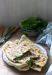Baker making traditional dish of Armenians from Artsakh Zhingyalov hats is a type of flatbread stuffed with herbs.