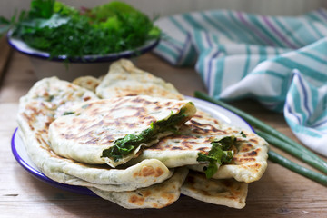 Baker making traditional dish of Armenians from Artsakh Zhingyalov hats is a type of flatbread stuffed with herbs.