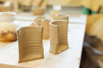 Fresh unprocessed clay pot being separated on two pieces