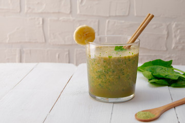 Low carb detox smoothie with matcha, spinach and banana. Image with copy space.
