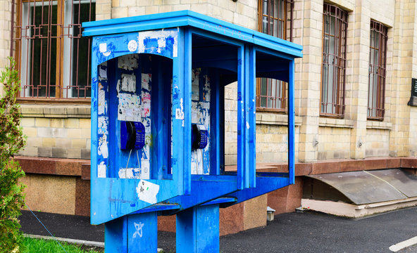 Blue Payphone On The Background Of The Building