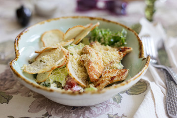 Cesar salad on light table