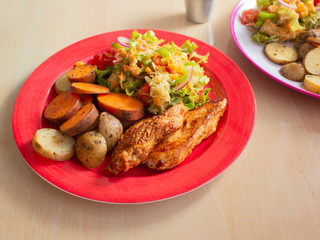 Smoked Grilled Chicken with BBQ Sauce and a mix of Potatoes and Sweet Potatoes and Green Salad with Yellow Corn