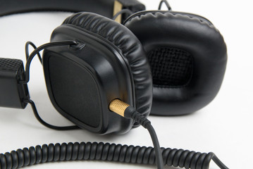 black headphones closeup on white background