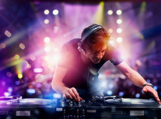 DJ playing music at the discotheque
