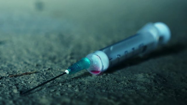 Illustration of narcotic addiction. Young junkie injects heroin into his vains.