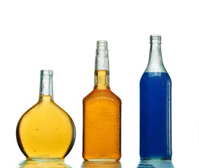 Various alcoholic drinks in transparent bottles