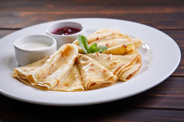 pancakes with sour cream and berry sauce