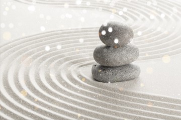 Zen stones in the sand. Beige background - obrazy, fototapety, plakaty