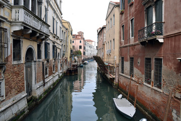 View of a typical Venetian canal with old buildings.
