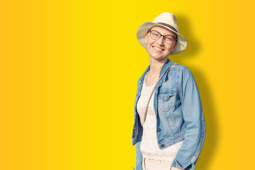 Happy young caucasian bald woman in hat and casual clothes enjoying life after surviving breast...