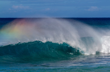 Beautiful Breaking Wave with rainbow colors in Hawaii