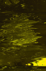 Abstract art texture background. Water surface in motion design. Yellowish paint with ripple effect.