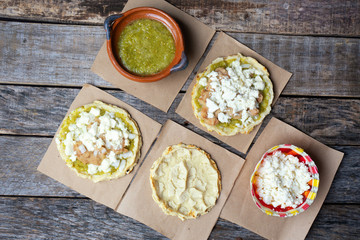 Mexican food: sopes with green sauce and beans