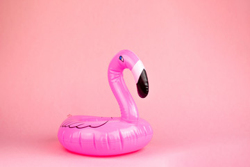 Giant inflatable Flamingo on a pink background, pool float party, trendy summer concept