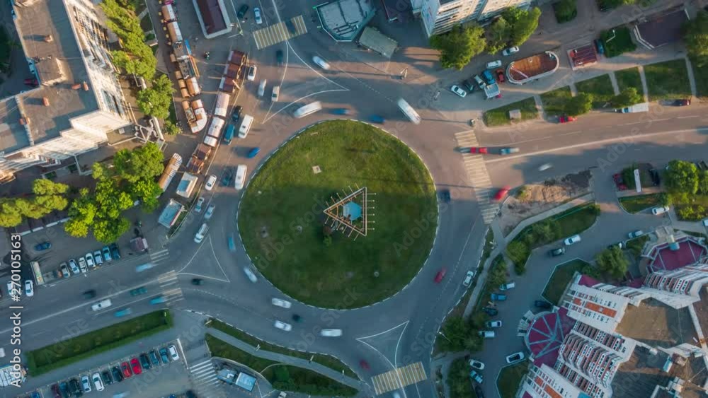 Wall mural aerial 4k top view hyperlapse video of traffic in a circle