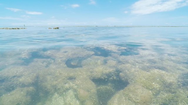 View of the sea and the corals underwater in the middle of the sea at Caribessa - Bessa beach (Praia do Bessa). Tourist destination of Joao Pessoa PB, Brazil. Low tide 