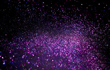 Purple sparkling shiny blurred background. Festive backdrop.