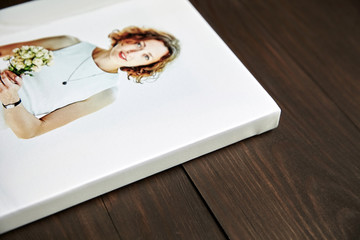 Photo canvas print with gallery wrapping. Photography of woman stretched on stretcher bar, lateral side. Wall decor