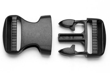 black plastic Fastex clip for backpacks on a white background
