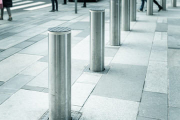 Stainless steel bollard entering pedestrian area on Vienna city street. Car and vehicle traffic access control - obrazy, fototapety, plakaty