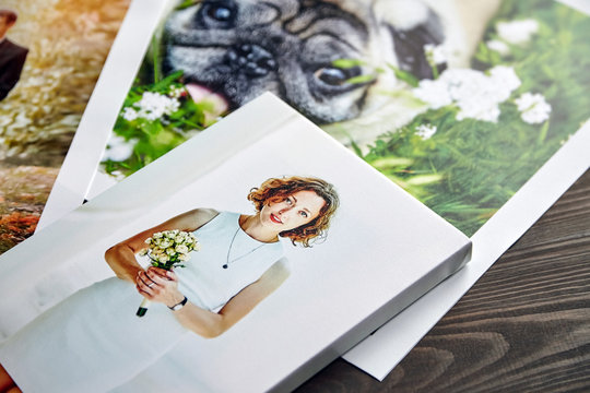 Photo canvas prints. Sample of stretched photography of woman with gallery wrap. Printed photos of a dog and a wedding couple lying on a table