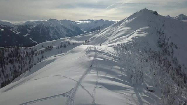 Aerial panoramic view of the mountains in Flachau, Austria during sunset