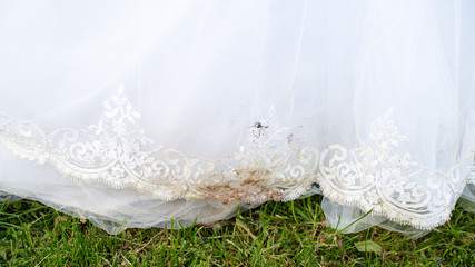Dirty wedding dress. Bridal white dress has lost its look. Theme of dry cleaning and laundry...