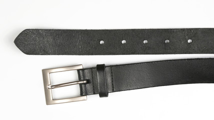 black leather belt on white background. items of clothing and equipment.