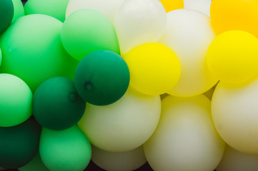 A lot of multicolored balloons, green and white, pride festival