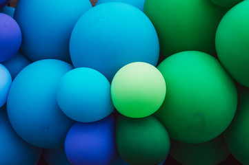 A lot of  multicolored balloons, green and blue, pride festival