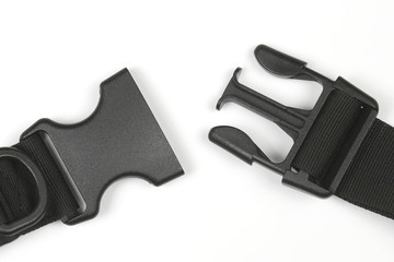 black plastic Fastex clip for backpacks on a white background