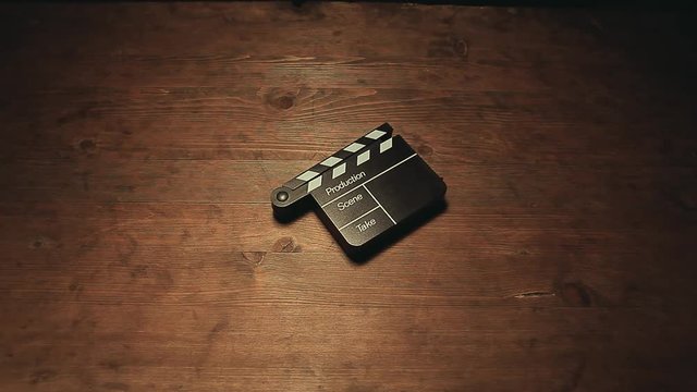 hat hand clapper board wooden table hd footage 