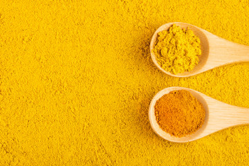 Turmeric and curry organic powder - Top view - obrazy, fototapety, plakaty