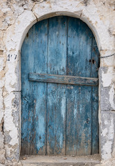 Old blue wooden door in Crete
