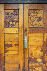 Ornate hand carved heavy old varnished wooden door with Dogwood Flower design.