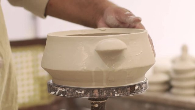 Closeup Of A Potter Sculpting Multan Pottery On A Spinning Wheel In Slow Motion.