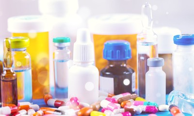 Colorful pills and tablets on background