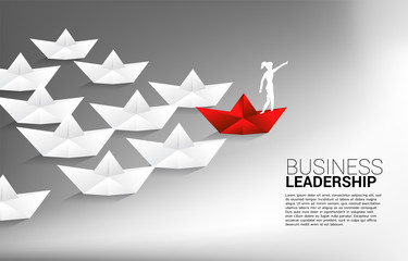Naklejka premium silhouette of businessman point forward on red origami paper ship leading group of ship. Business Concept of leadership and vision mission.